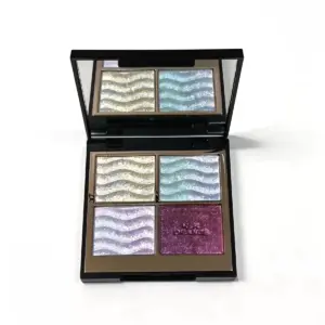 Private label 4 color eyeshadow palette with wavy embossed shimmer pans in champagne gold, ice blue, lilac and berry glitter
