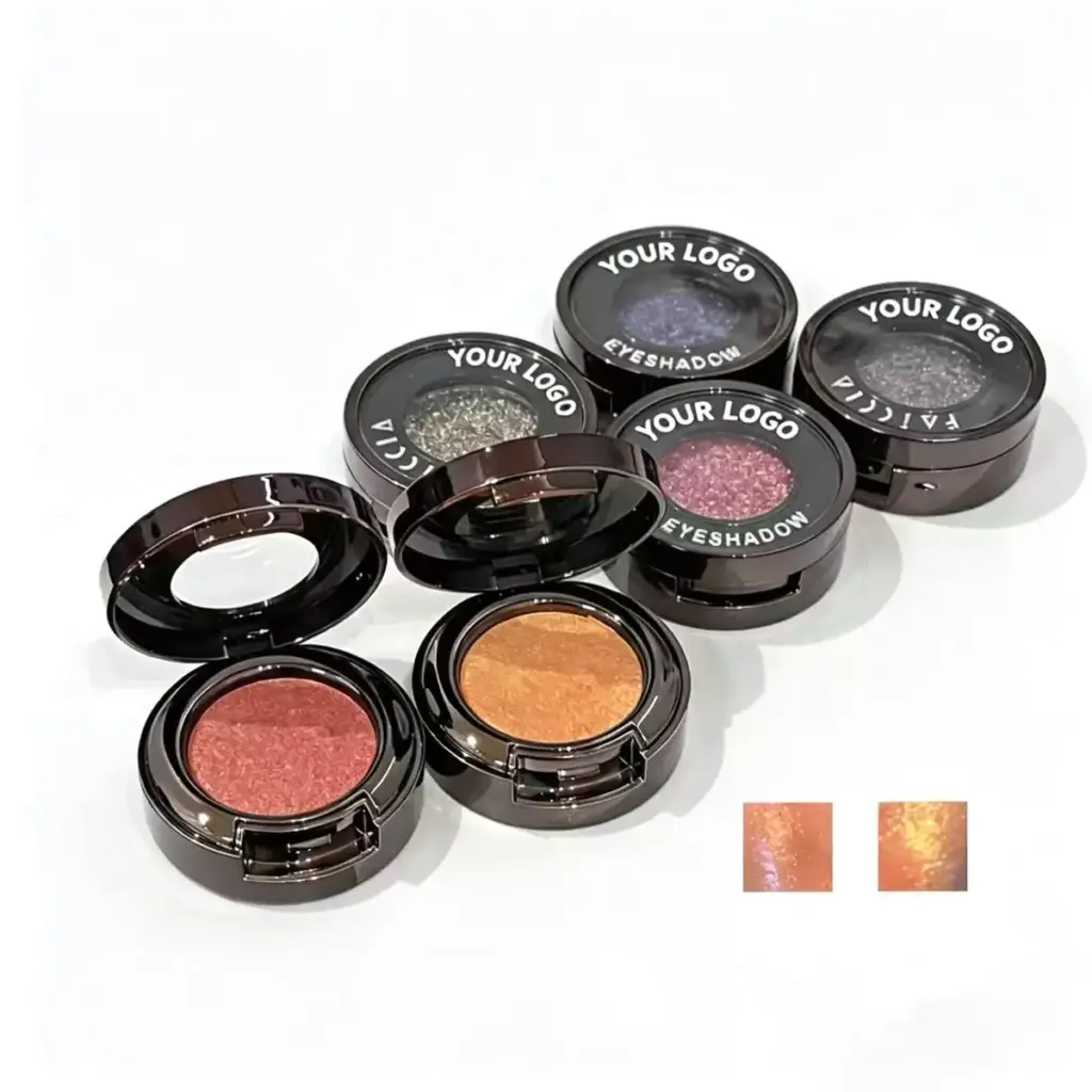 Private label pressed glitter eyeshadow in round black window pots across rose, amber, fuchsia, blue and charcoal shades